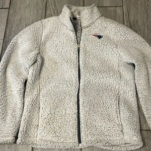 Patriots Zip up Sherpa fleece with pockets and NFL Patriots logo.